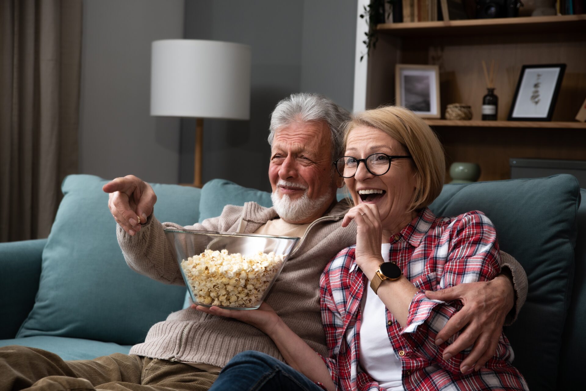 Laughing,Aged,Couple,,Man,And,Woman,Watching,Tv,,Comedy,Show